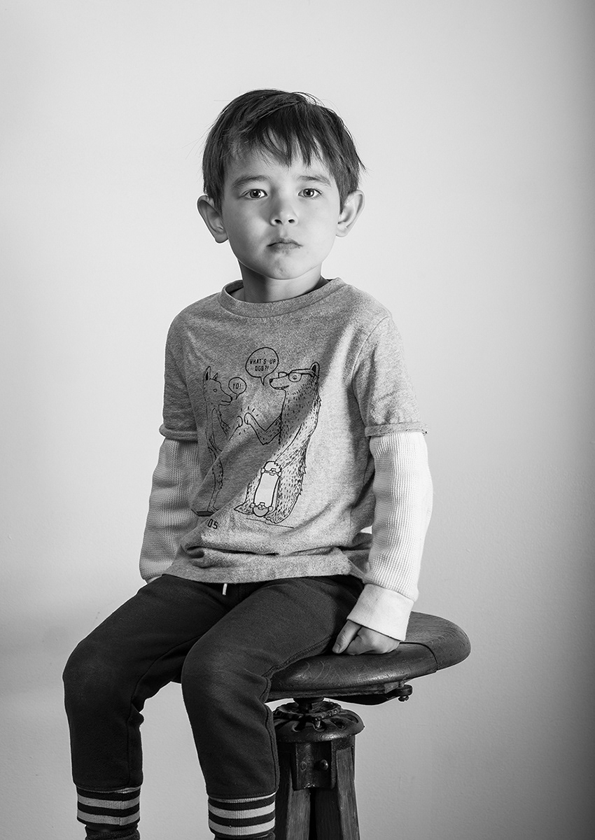 Youth portrait on a stool.
